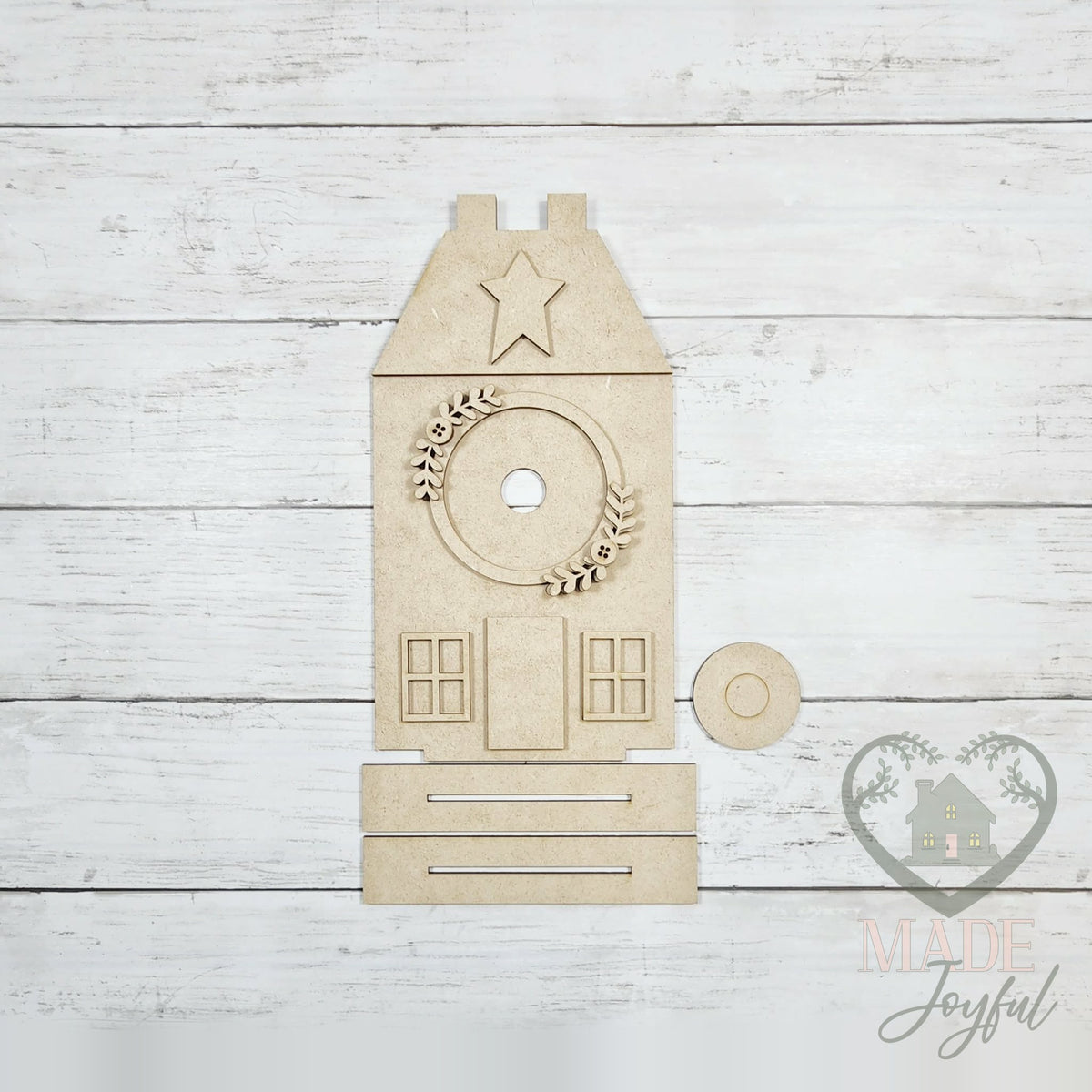 Unfinished laser-cut wood Saltbox House Interchangeable Display DIY kit (tabbed pieces), ready to paint at a DIY party in Williamson County, TN.