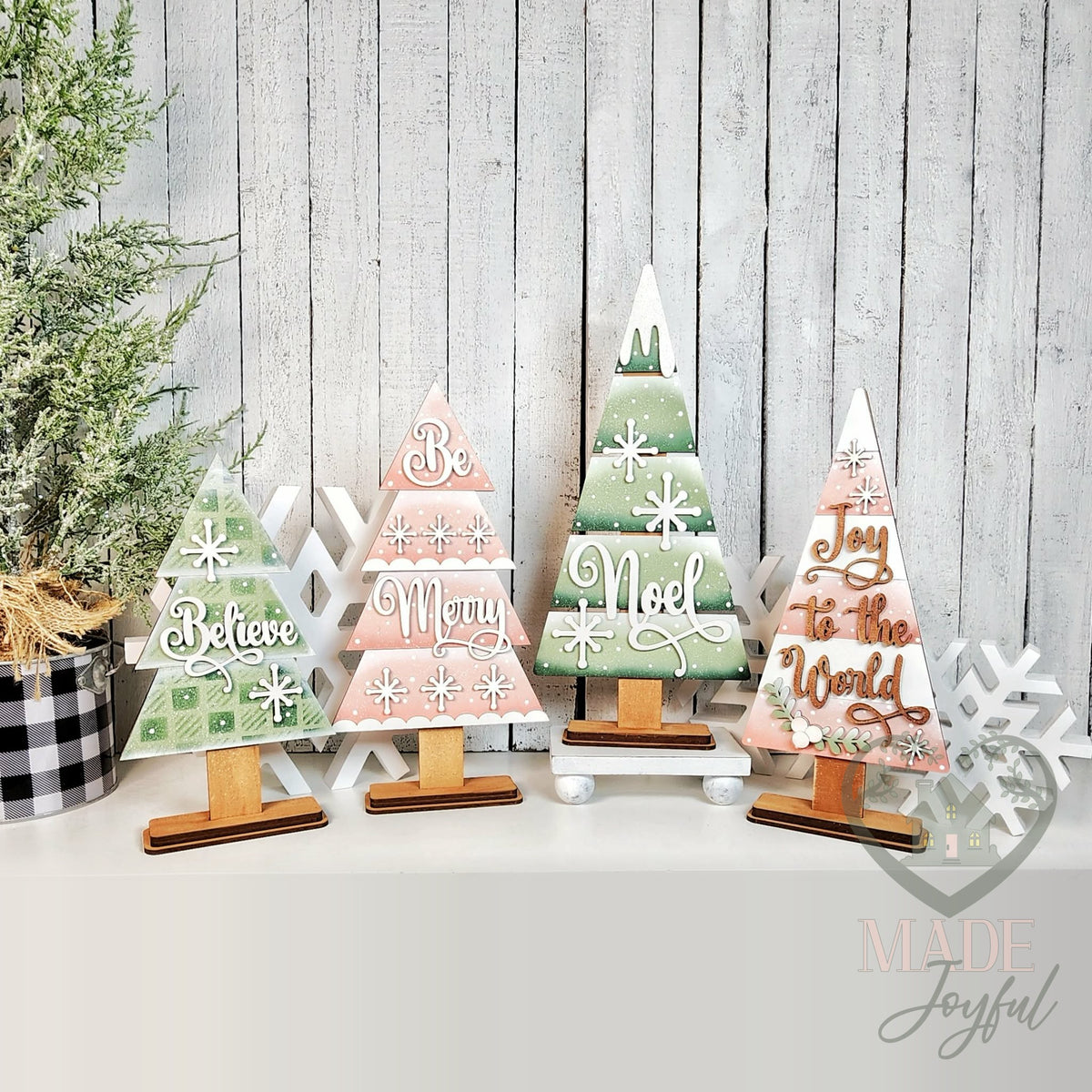 Four Christmas tree shelf sitters with Believe, Be Merry, Noel, and Joy to the World, hand-painted in Brentwood, TN.