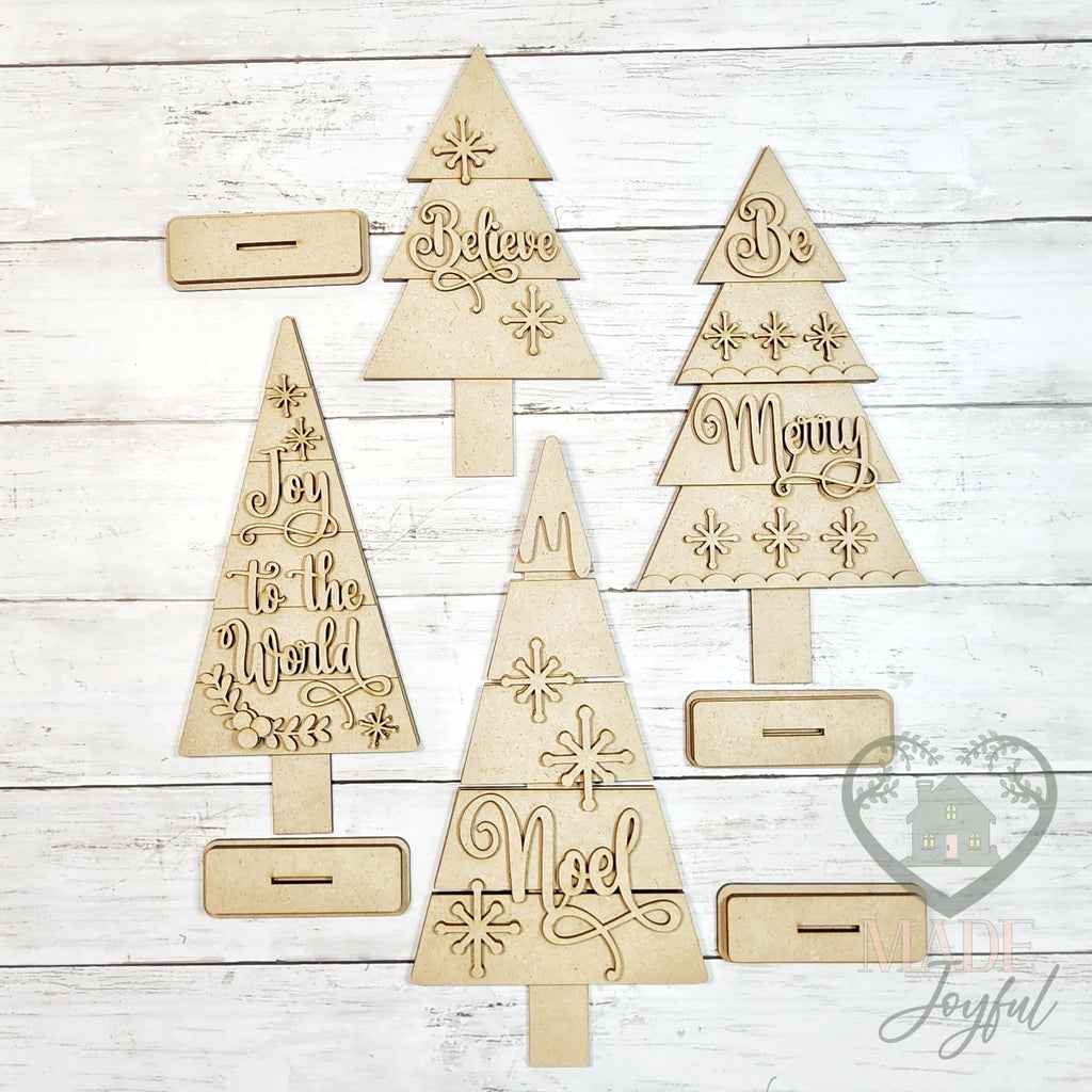 Unfinished laser-cut wood Classic Christmas Tree Shelf Sitters DIY kit, ready to paint at a DIY party in Williamson County, TN.