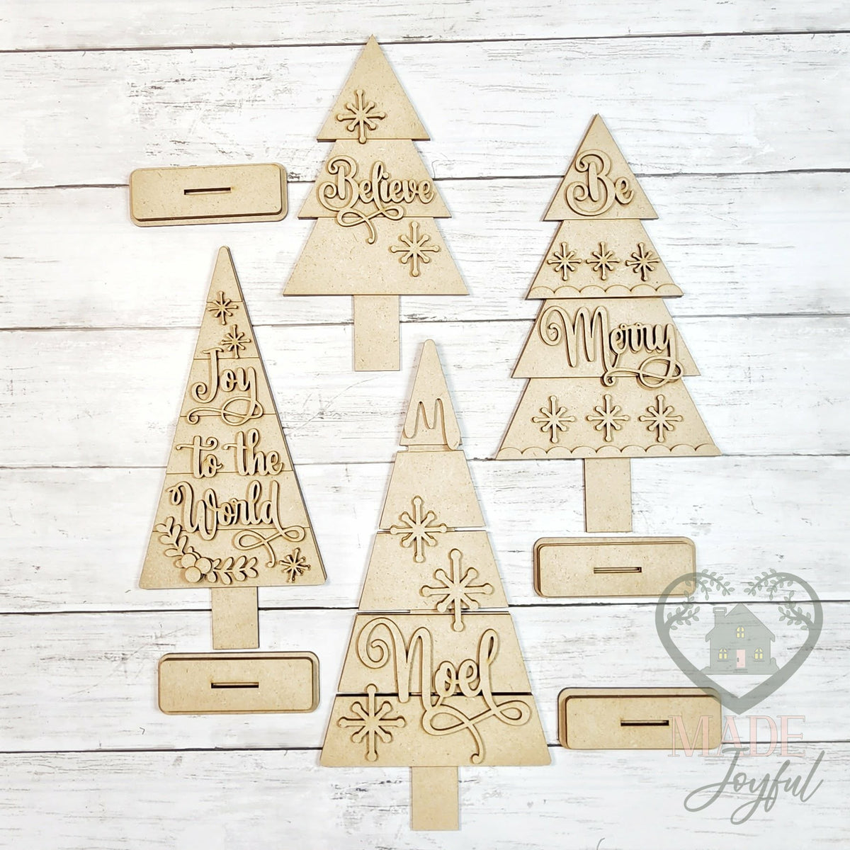 Unfinished laser-cut wood Classic Christmas Tree Shelf Sitters DIY kit, ready to paint at a DIY party in Williamson County, TN.