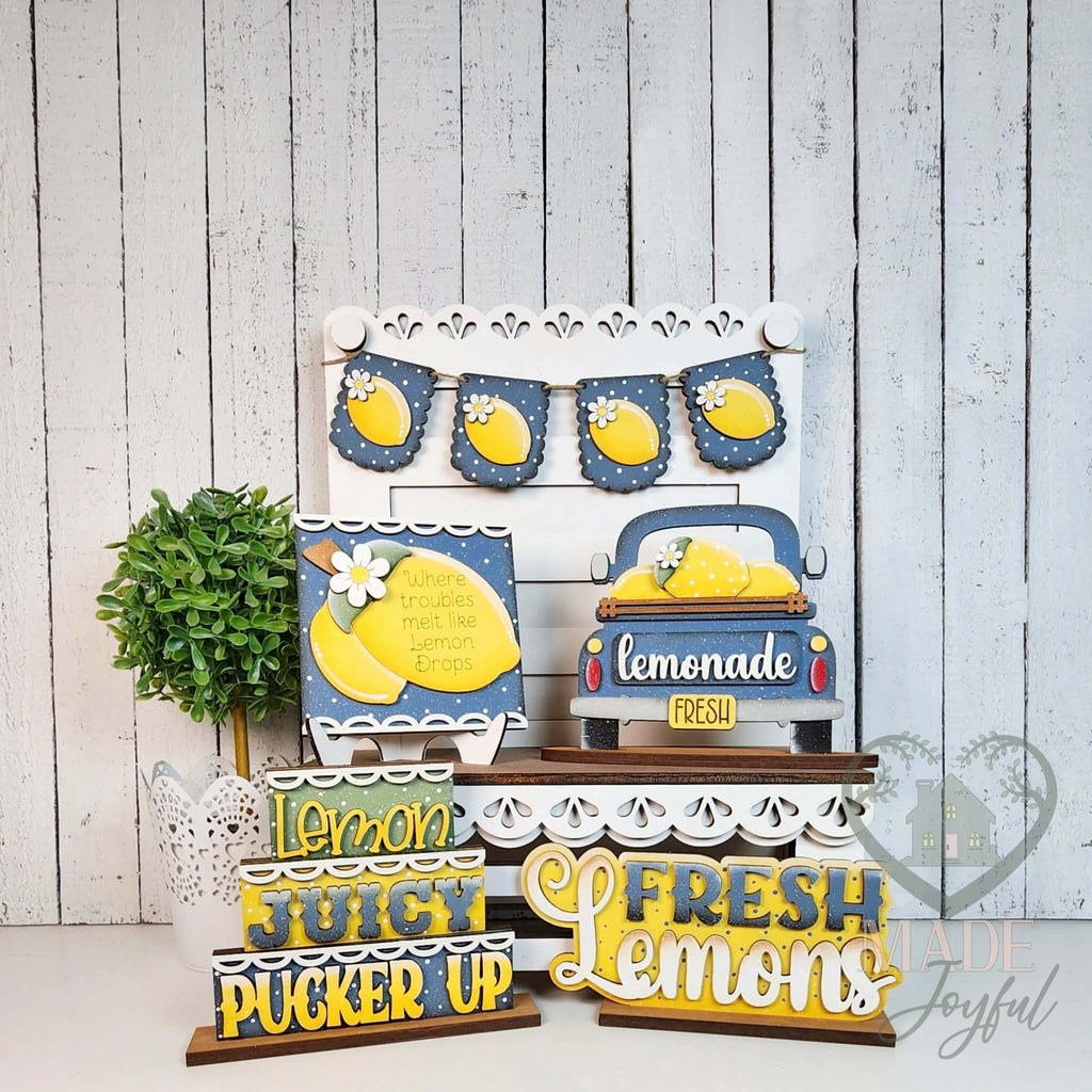 Fresh lemonade tiered tray set with lemon banner, truck, and Juicy Pucker Up sign, hand-painted in Brentwood, TN.
