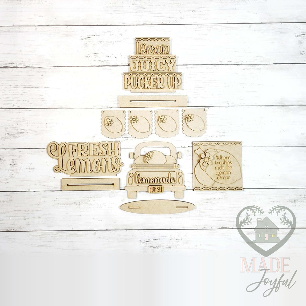 Unfinished laser-cut wood Fresh Lemonade Tiered Tray Decor Set DIY kit, ready to paint at a DIY party in Williamson County, TN.