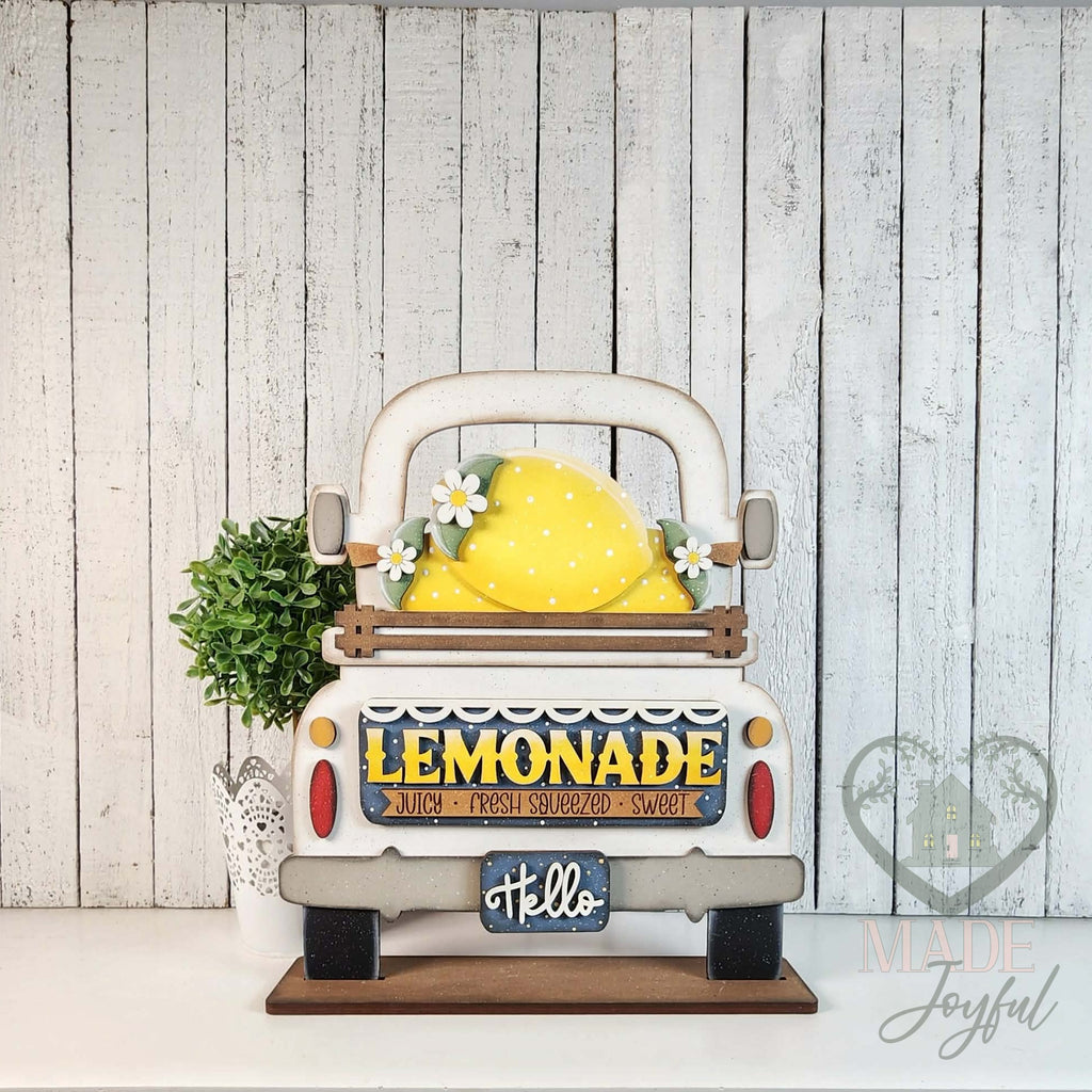 Lemonade insert in a white truck, hand-painted in Brentwood, TN.