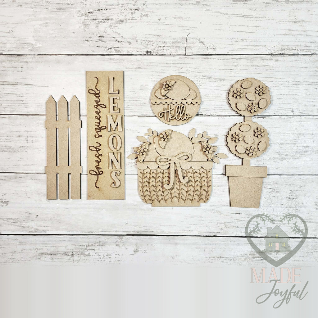 Unfinished laser-cut wood Lemon Mini Porch Barn Door Set DIY kit, ready to paint at a DIY party in Williamson County, TN.