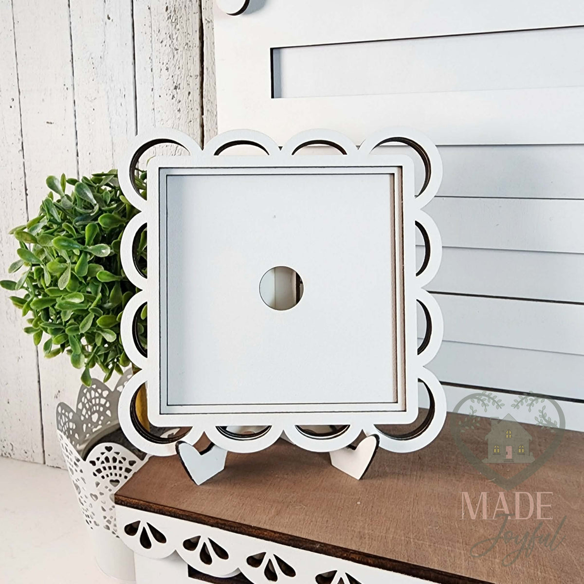 White scallop lace frame on an easel, hand-painted in Brentwood, TN.