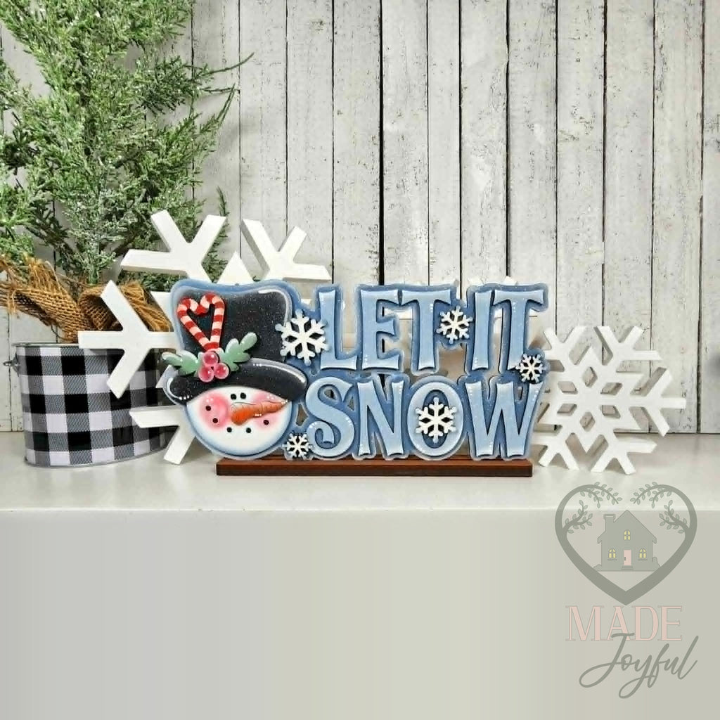 Let It Snow word art with snowman head and blue letters, hand-painted in Brentwood, TN.