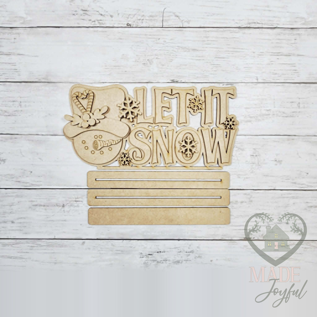 Unfinished laser-cut wood Let It Snow Snowman Word Art DIY kit, ready to paint at a DIY party in Williamson County, TN.