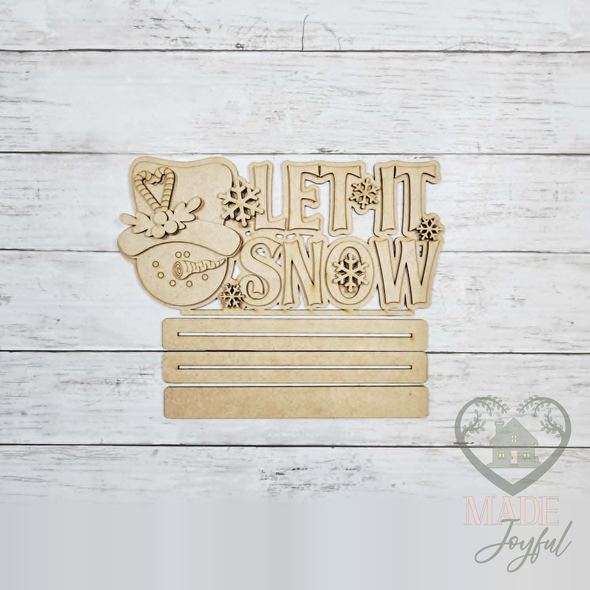 Unfinished laser-cut wood Let It Snow Snowman Word Art DIY kit, ready to paint at a DIY party in Williamson County, TN.