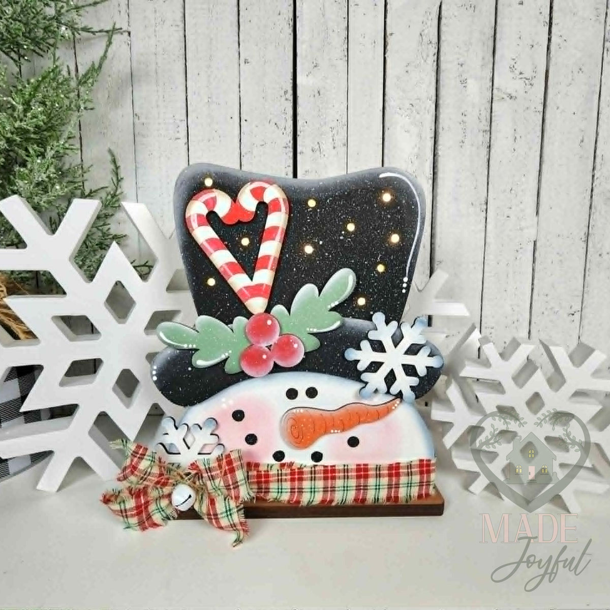 Sweet snowman light up shelf sitter with black hat and candy cane heart, hand-painted in Brentwood, TN.