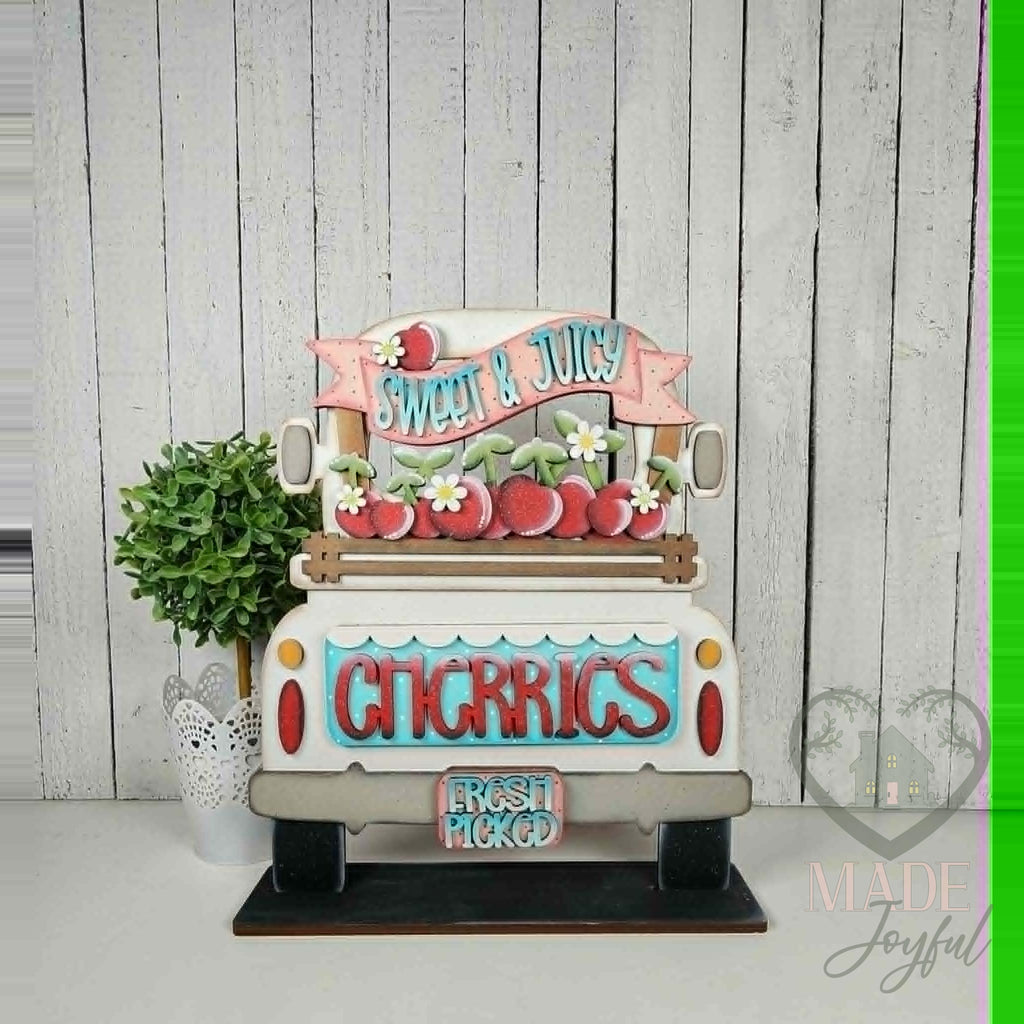 Sweet and Juicy Cherries insert in a white truck, hand-painted in Brentwood, TN.
