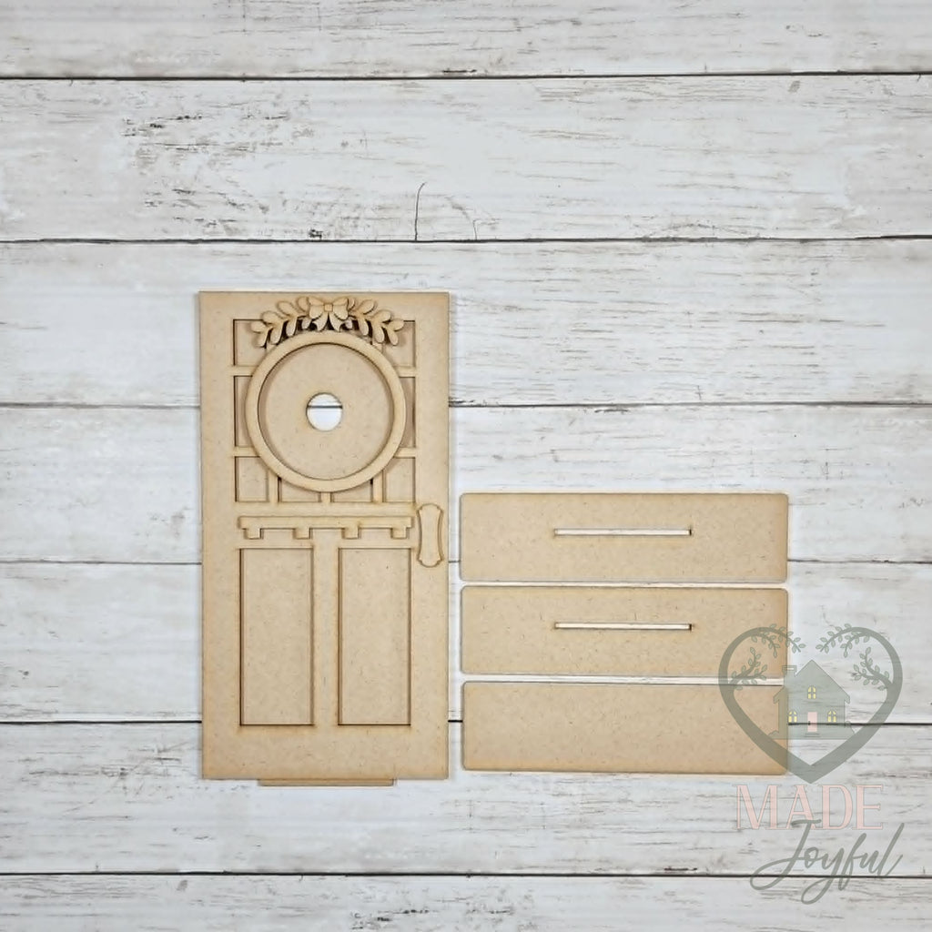 Unfinished laser-cut wood Craftsman Mini Porch Door DIY kit (door only pieces), ready to paint at a DIY party in Williamson County, TN.