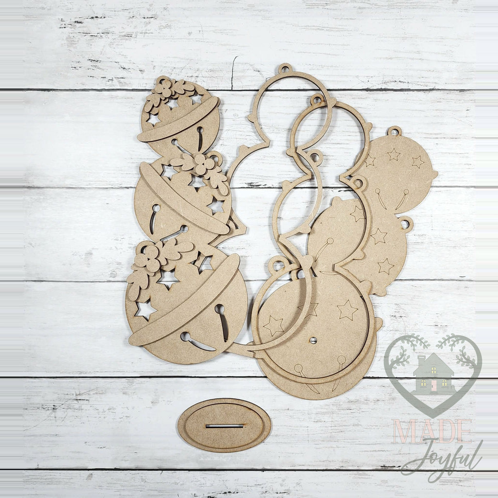 Unfinished laser-cut wood Lighted Jingle Bell Shelf Sitter DIY kit, ready to paint at a DIY party in Williamson County, TN.
