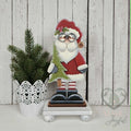 Standing St. Nick shelf sitter holding a Christmas tree, hand-painted in Brentwood, TN.