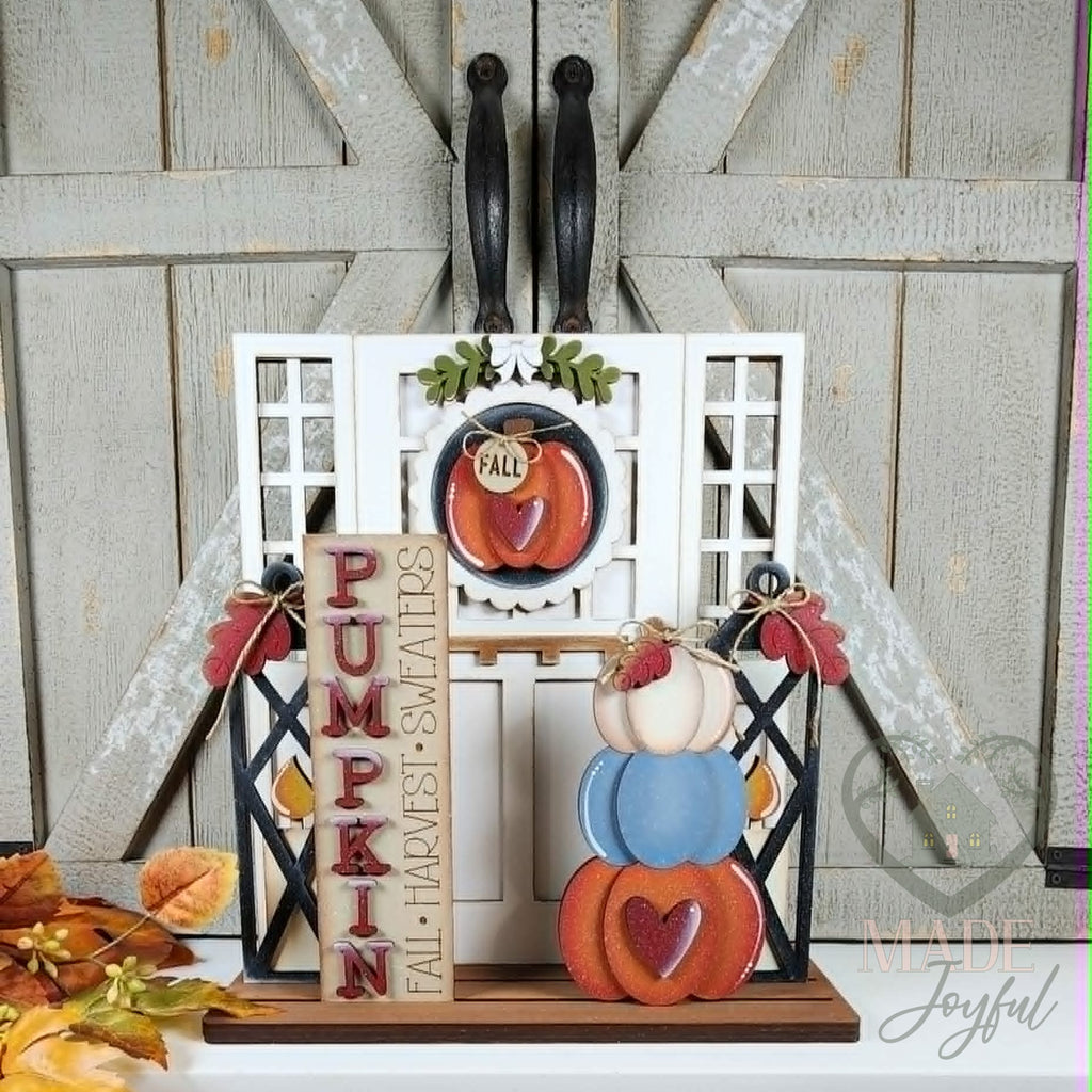 Pumpkin porch door insert set in a white craftsman door, hand-painted in Brentwood, TN.