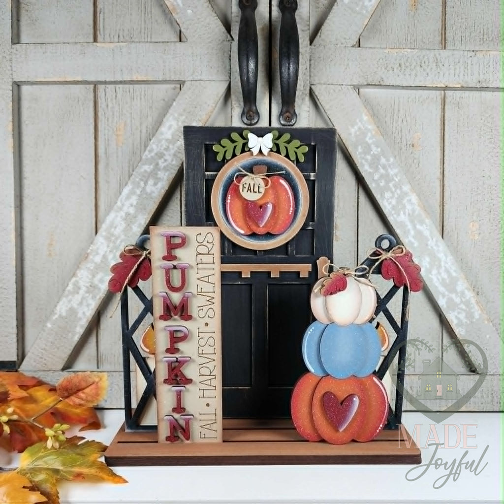 Pumpkin porch insert set in a black door, hand-painted in Brentwood, TN.