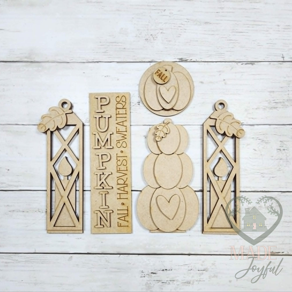 Unfinished laser-cut wood Pumpkin Porch Door Insert Set DIY kit, ready to paint at a DIY party in Williamson County, TN.