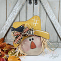 Scarecrow face shelf sitter with straw hat, crow, and plaid bow, hand-painted in Brentwood, TN.