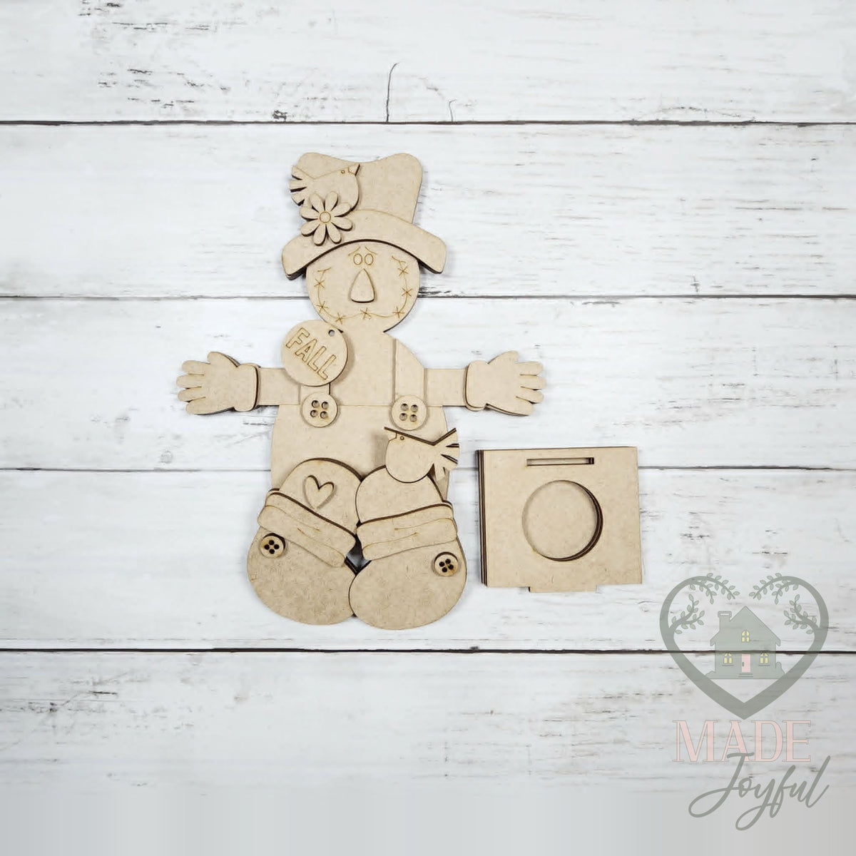 Unfinished laser-cut wood Scarecrow Votive Shelf Sitter DIY kit, ready to paint at a DIY party in Williamson County, TN.
