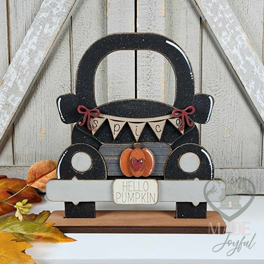 Black vintage truck with Hello Pumpkin insert, hand-painted in Brentwood, TN.