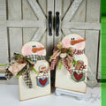 Pair of pocket snowmen shelf sitters with tiny friends in their pockets, hand-painted in Brentwood, TN.