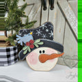 Snowman face shelf sitter with snowflake hat and bluebird, hand-painted in Brentwood, TN.