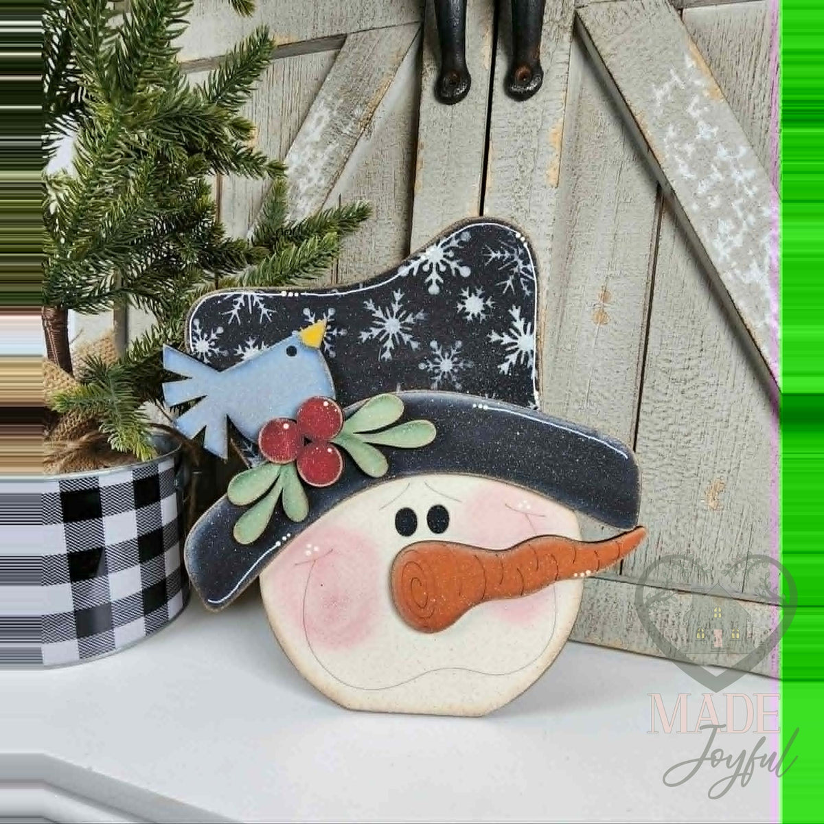 Snowman face shelf sitter with snowflake hat and bluebird, hand-painted in Brentwood, TN.