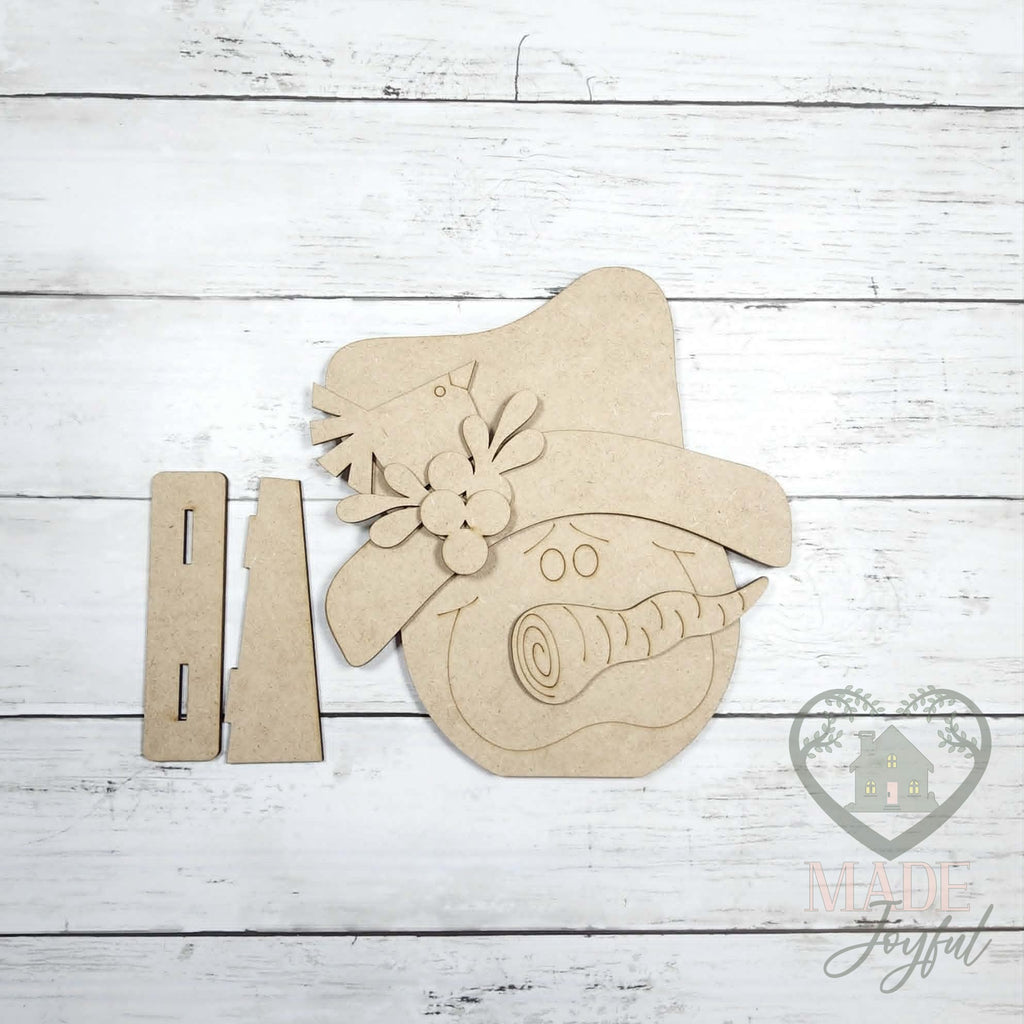 Unfinished laser-cut wood Snowman Face Shelf Sitter DIY kit, ready to paint at a DIY party in Williamson County, TN.