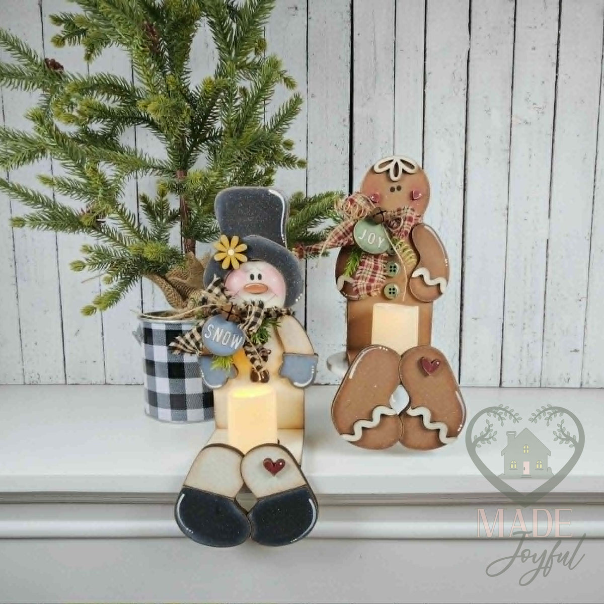 Snowman and gingerbread votive shelf sitters with LED candles, hand-painted in Brentwood, TN.