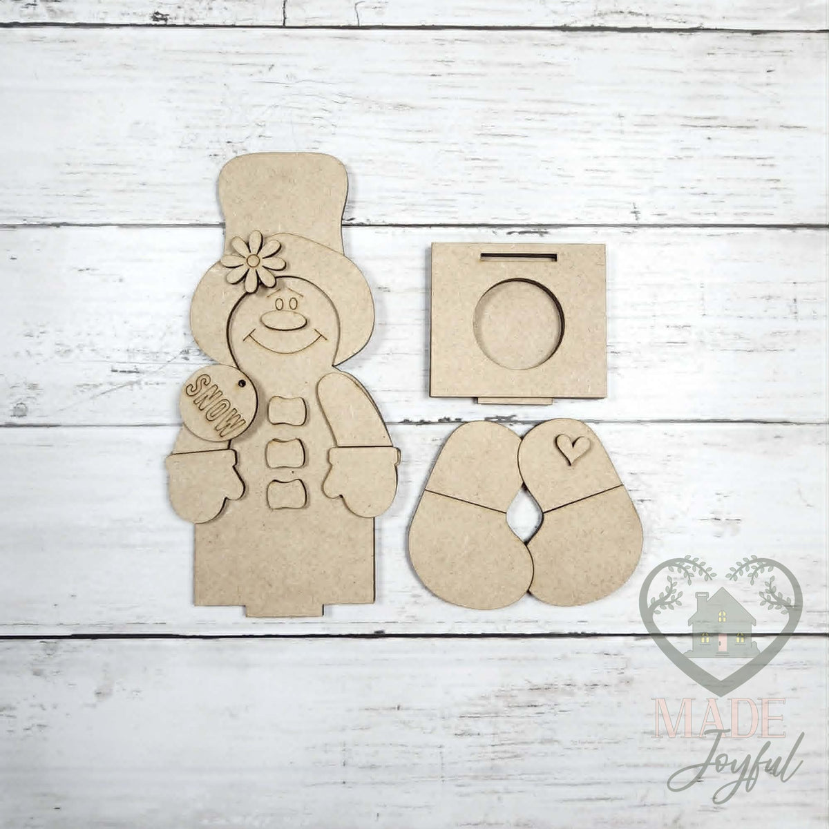 Unfinished laser-cut wood Sweet Friends Votive Shelf Sitters DIY kit (snowman pieces), ready to paint at a DIY party in Williamson County, TN.