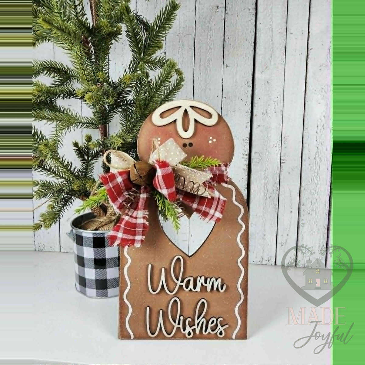 Warm Wishes gingerbread shelf sitter with plaid bow, hand-painted in Brentwood, TN.