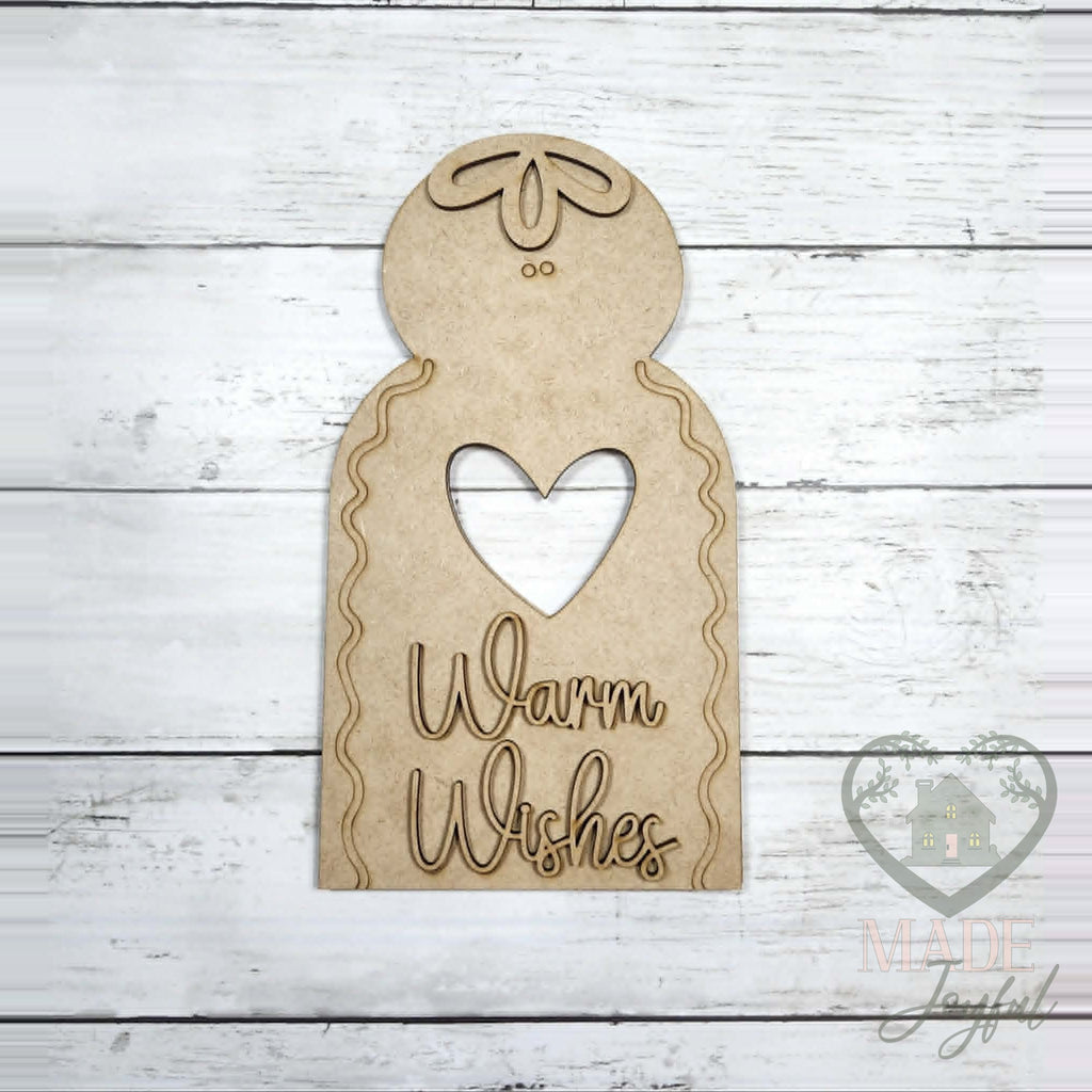 Unfinished laser-cut wood Warm Wishes Gingerbread Shelf Sitter DIY kit, ready to paint at a DIY party in Williamson County, TN.