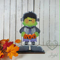 Frankie Frankenstein shelf sitter holding BOO sign, hand-painted in Brentwood, TN.