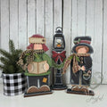Christmas carolers with lamp post, hand-painted in Brentwood, TN.