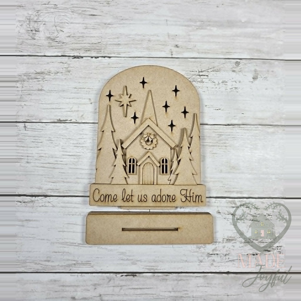 Unfinished laser-cut wood Come Let Us Adore Him Light Up Church DIY kit, ready to paint at a DIY party in Williamson County, TN.