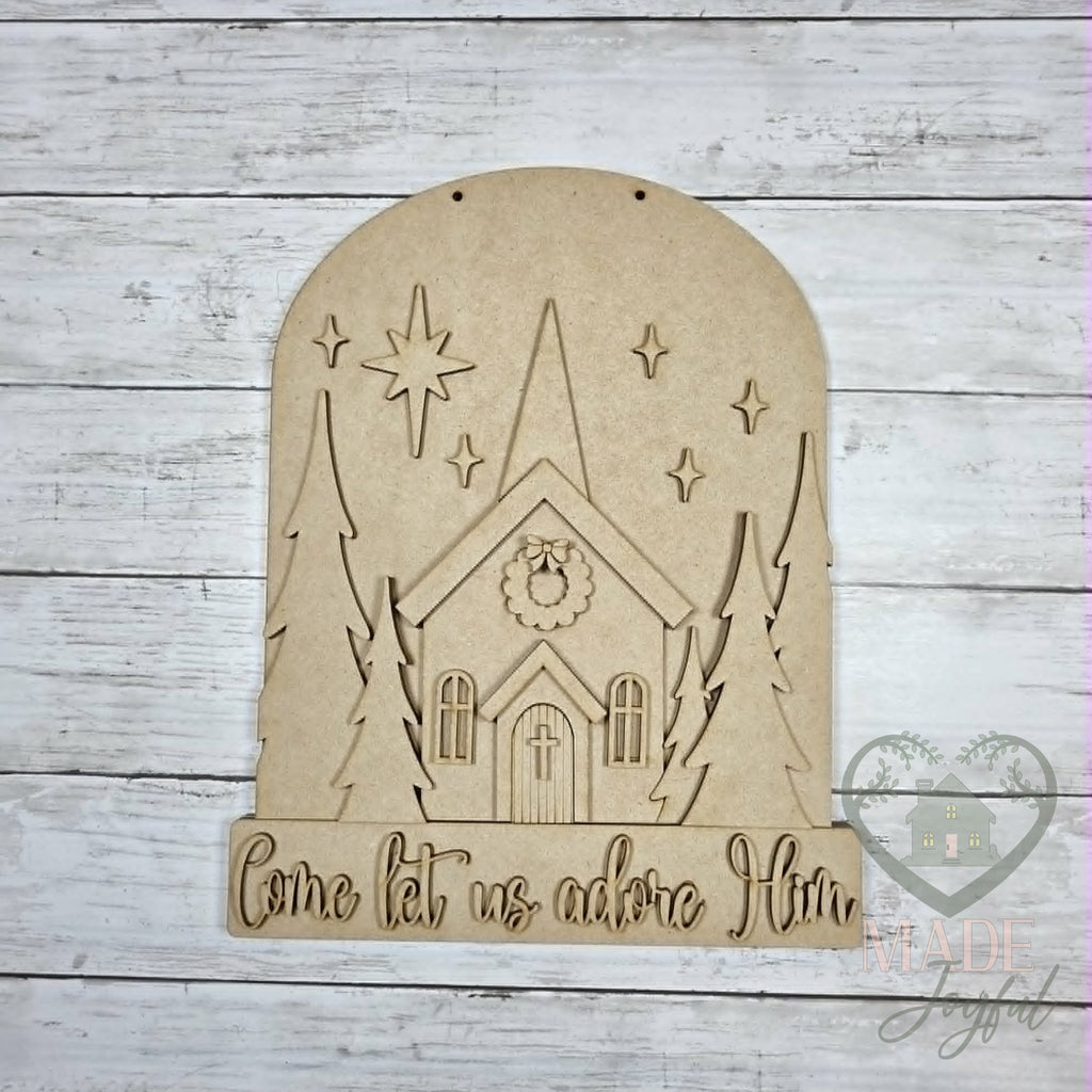 Unfinished laser-cut wood Come Let Us Adore Him Church Door Hanger DIY kit, ready to paint at a DIY party in Williamson County, TN.