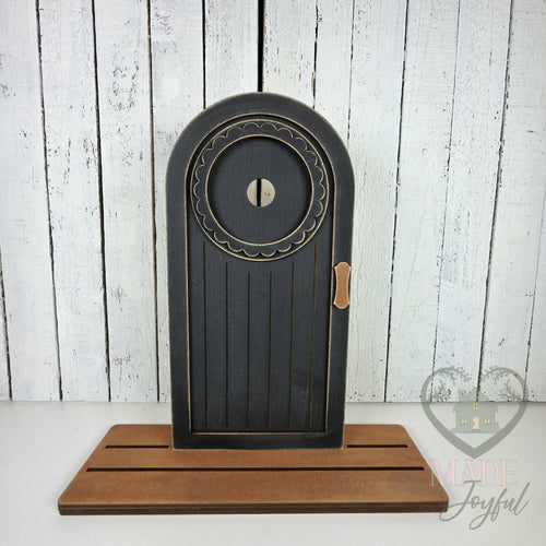 Black arched mini porch door, hand-painted in Brentwood, TN.