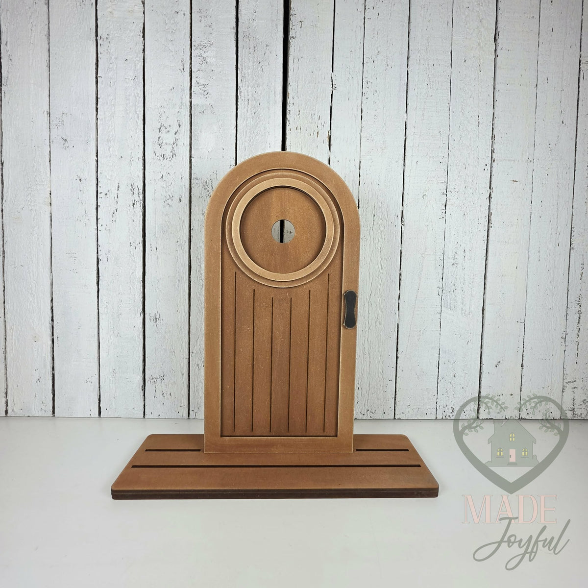 Brown arched mini porch door, hand-painted in Brentwood, TN.