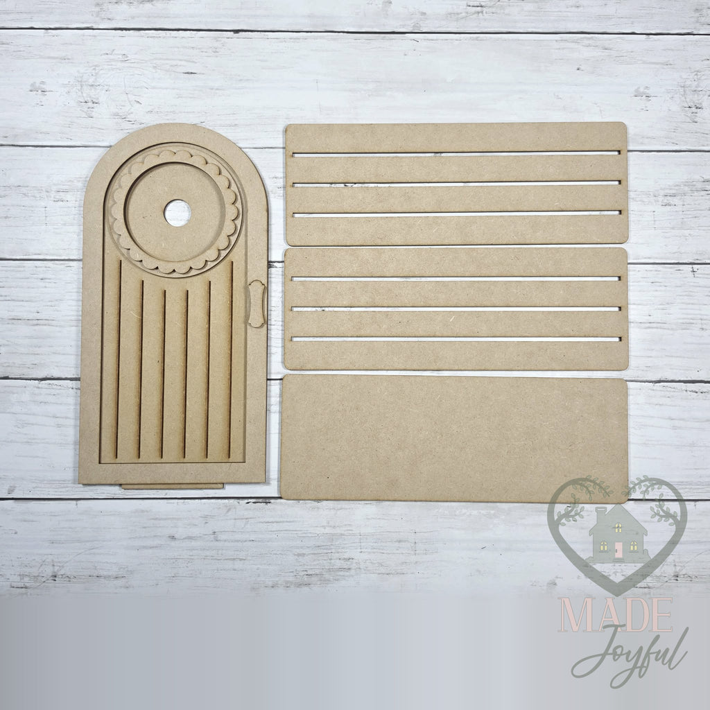 Unfinished laser-cut wood Arched Mini Porch Door DIY kit, ready to paint at a DIY party in Williamson County, TN.