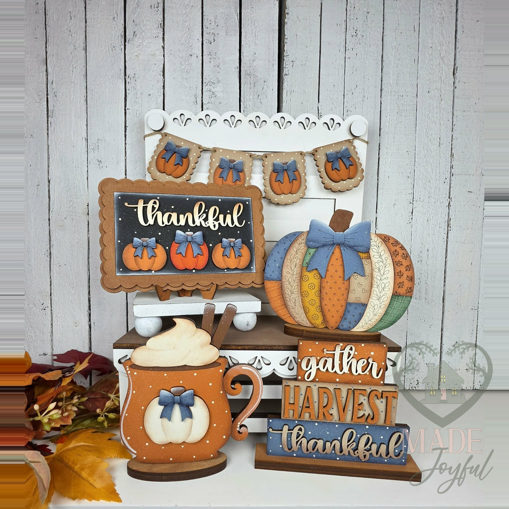 Thankful tiered tray set with patchwork pumpkin, latte mug, and Gather Harvest Thankful stacker, hand-painted in Brentwood, TN.