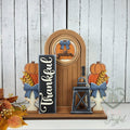 Thankful porch insert set in a brown arched door, hand-painted in Brentwood, TN.