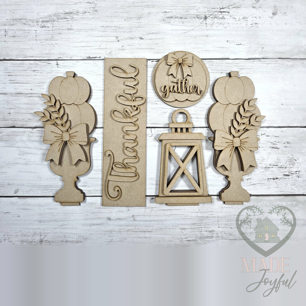 Unfinished laser-cut wood Thankful Porch Door Insert Set DIY kit, ready to paint at a DIY party in Williamson County, TN.
