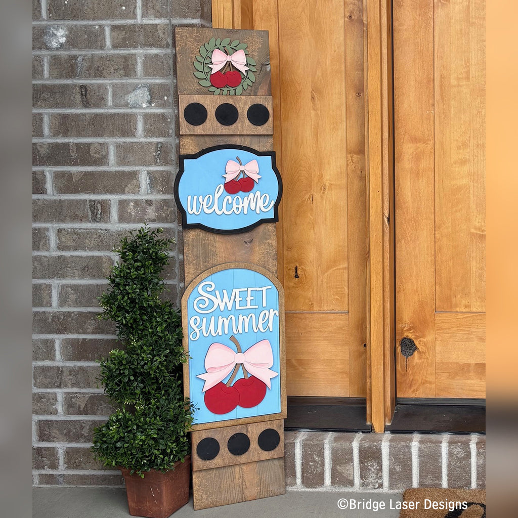 Sweet Summer cherries interchangeable porch leaner with a cherry wreath, a Welcome sign, and a Sweet Summer cherry sign on a stained wood base
