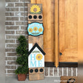 Sunflower interchangeable porch leaner with a sunflower, a Welcome sign, and a farmhouse HOME sign with a sunflower on a stained wood base