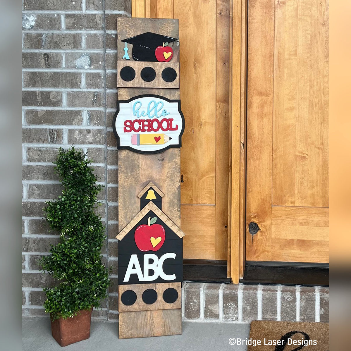 Hello School interchangeable porch leaner with a graduation cap, a Hello School sign, and a schoolhouse with ABC on a stained wood base
