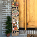 Happy Thanksgiving interchangeable porch leaner with a turkey, a Happy Thanksgiving sign, and a pilgrim couple with a pumpkin on a stained wood base