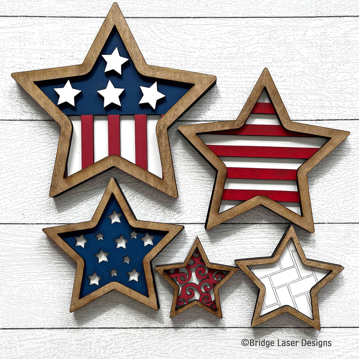Patriotic nesting stars set of five layered wood stars in red, white, and blue with stars and stripes, hand-painted in Brentwood, TN