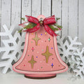 Pink retro light up Christmas bell with gold starbursts and a red ribbon bow on a wood base, hand-painted in Brentwood, TN.