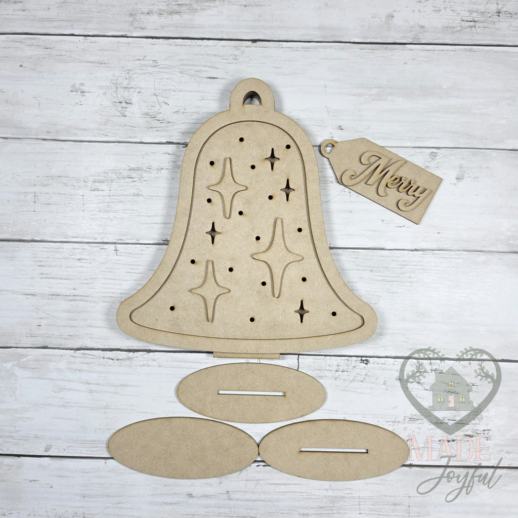 Unfinished laser-cut wood Retro Light Up Christmas Bell DIY kit, ready to paint at a DIY party in Williamson County, TN.