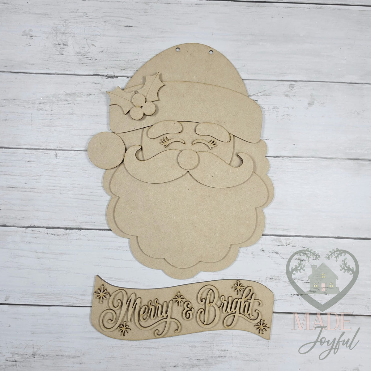Unfinished laser-cut wood Retro Santa Face Door Hanger DIY kit (Santa face and Merry & Bright banner pieces), ready to paint at a DIY party in Williamson County, TN.