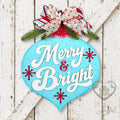 Aqua vintage bulb door hanger with Merry & Bright script, red starbursts, and a red and white bow, hand-painted in Brentwood, TN.
